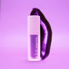 Diamond Smile Purple Teeth Bleaching värinkorjaus - seerumin violetti valkaisugeeli violetilla taustalla.
